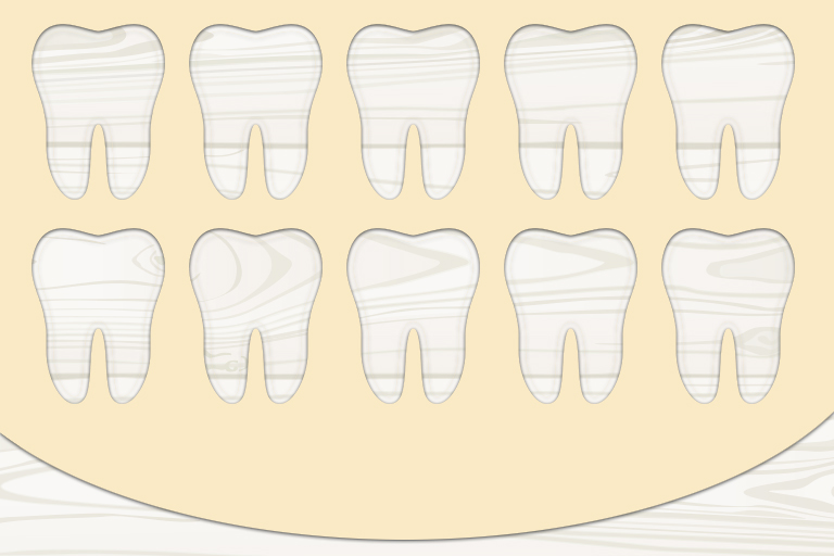 Cookie batter with tooth cookie shapes cut out